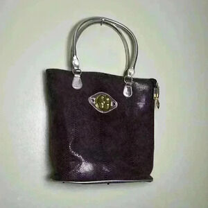 Iman brown and Gold Ladies hand bag.
